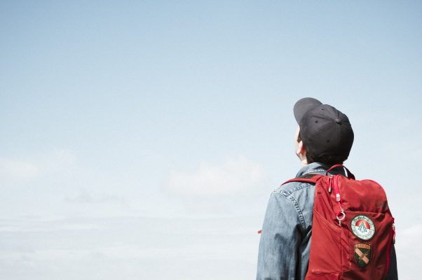 Boy staring up at the sky